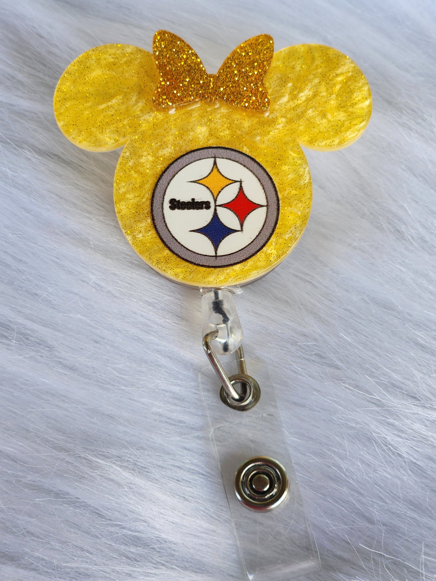 Black and yellow mouse head with bow